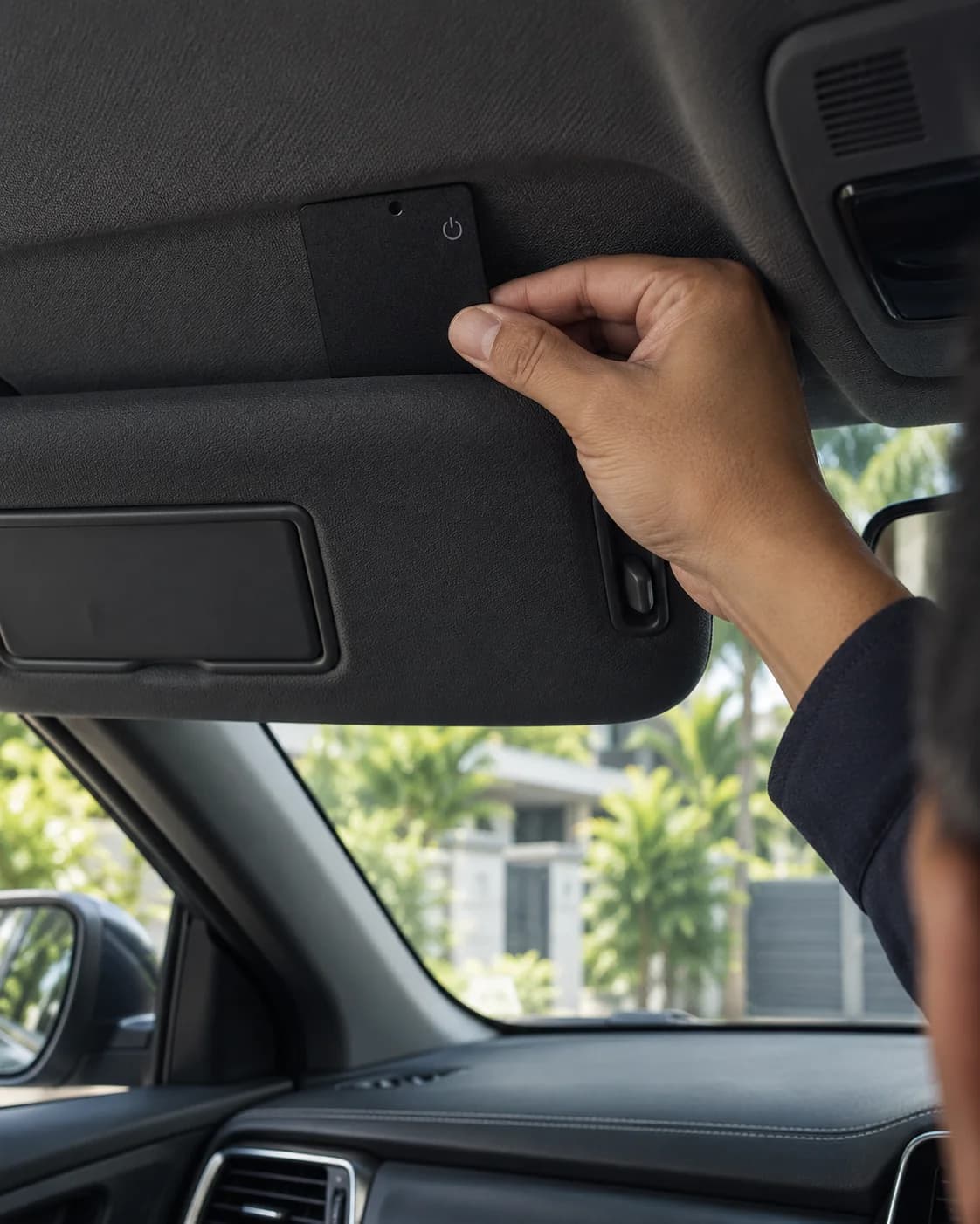 LOCAFI Slim tucked out of sight between a car’s sun visor and the headliner